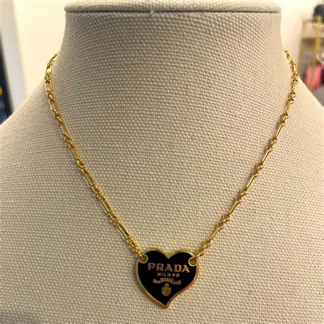 prada gold triangle necklace|Prada heart necklace.